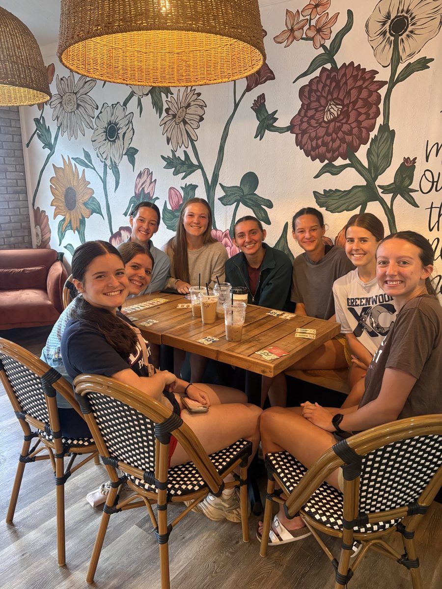Friends around a table with iced drinks