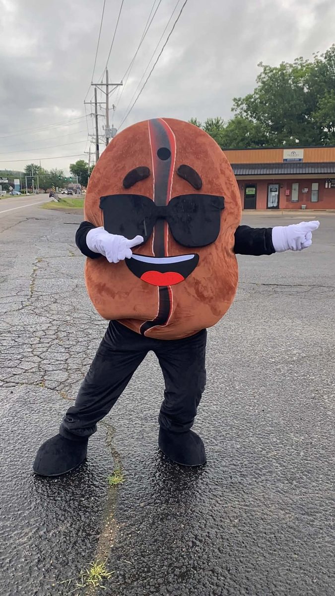 Mr. Bean, the mascot, waving out front
